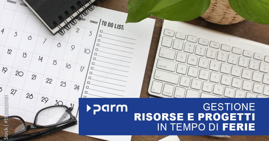 Postazione di lavoro con tastiera, calendario e occhiali da sole. Il dipendente è pronto per le vacanze